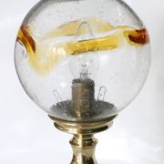 Table lamp in solid brass with a vintage 1970s glass globe.