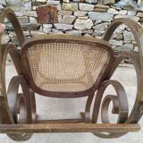 Vintage wooden and cane rocking chair