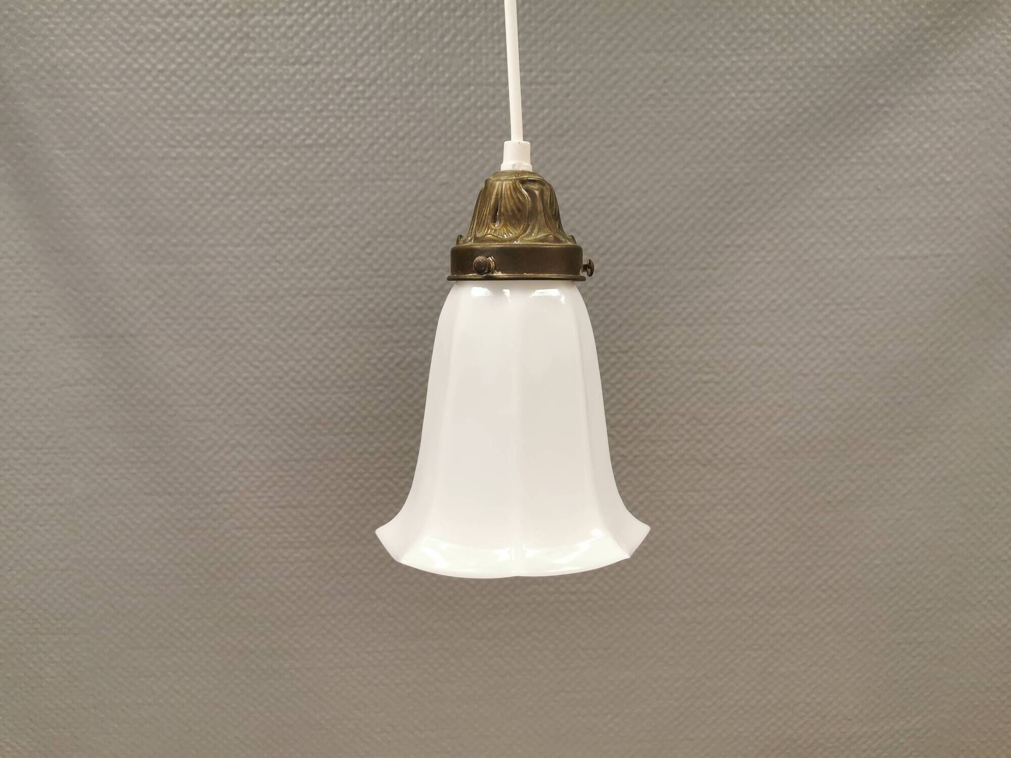 Small delicious tulip shaped hanging lamp in white opal glass with brass top.