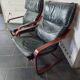 Pair of Scandinavian armchairs in leather and curved wood