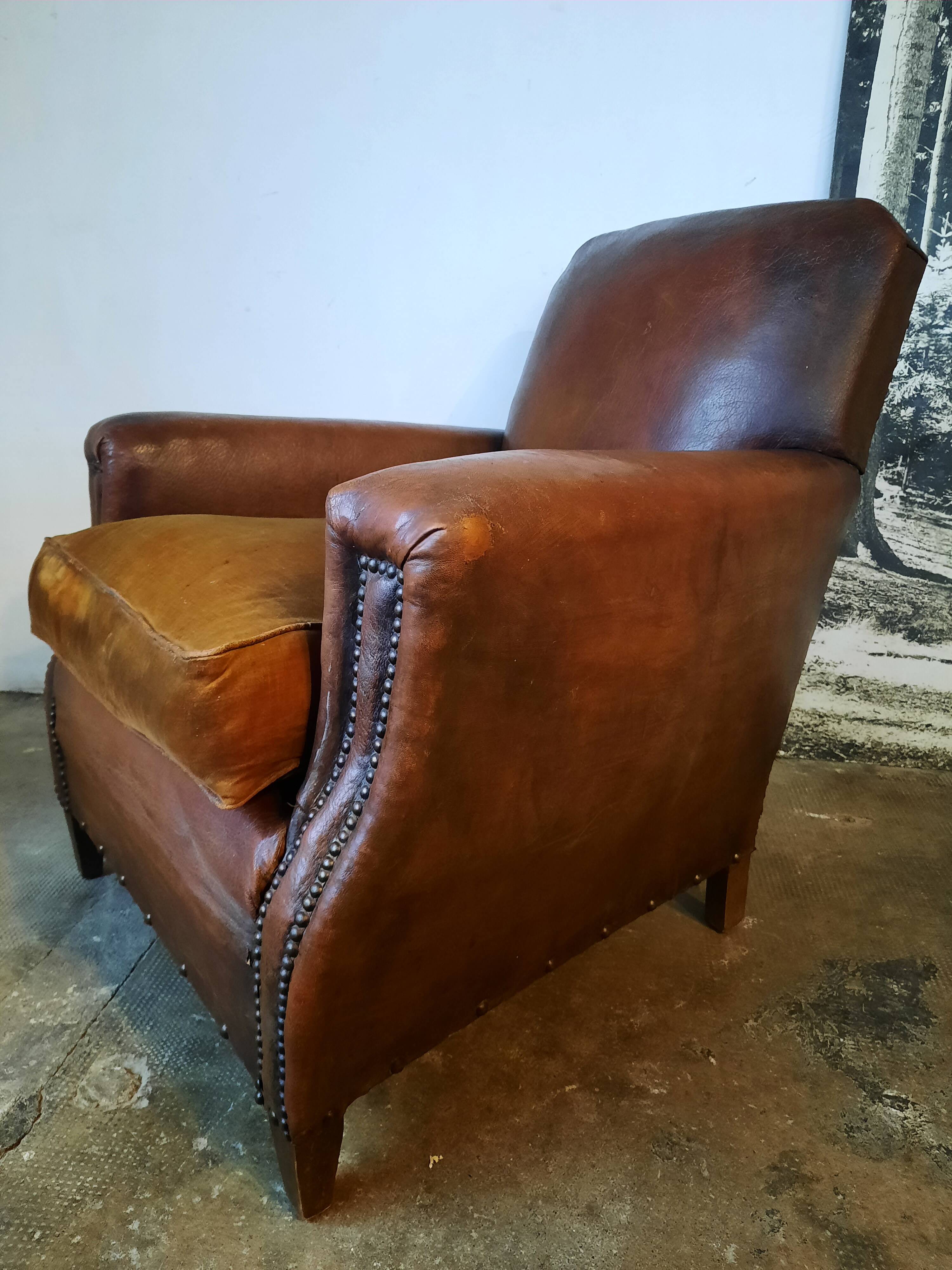 Old studded leather club chair 1930-1930