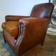 Old studded leather club chair 1930-1930