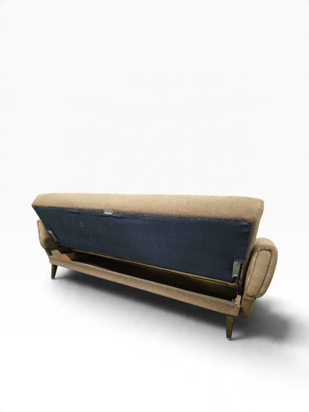 Vintage armchair/sofa/lounge in taupe colour with a stain.