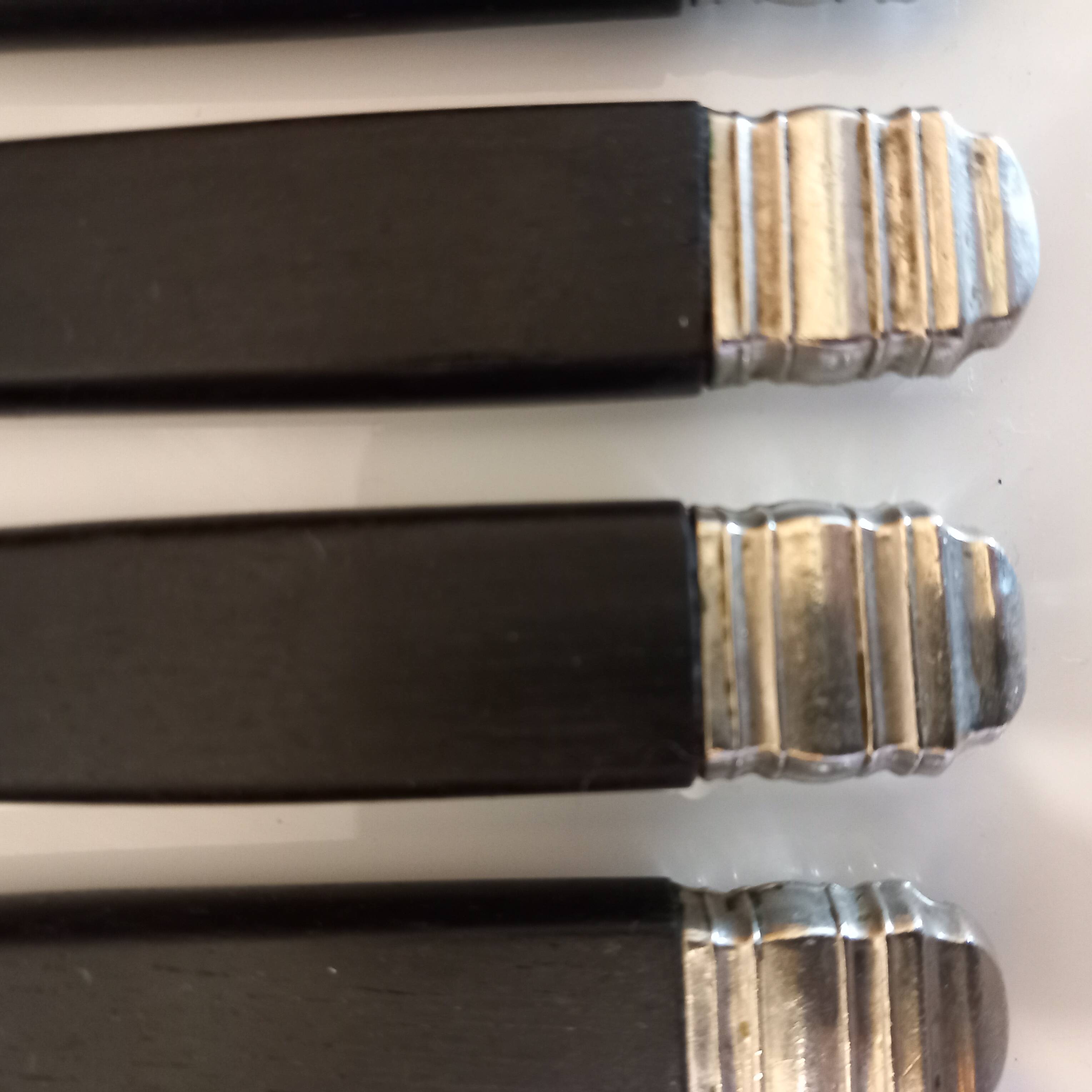 12 black Empire style table knives with silver ferrule Gimel