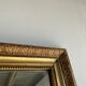 Gilded mirror with frieze h2m10 l:73cm