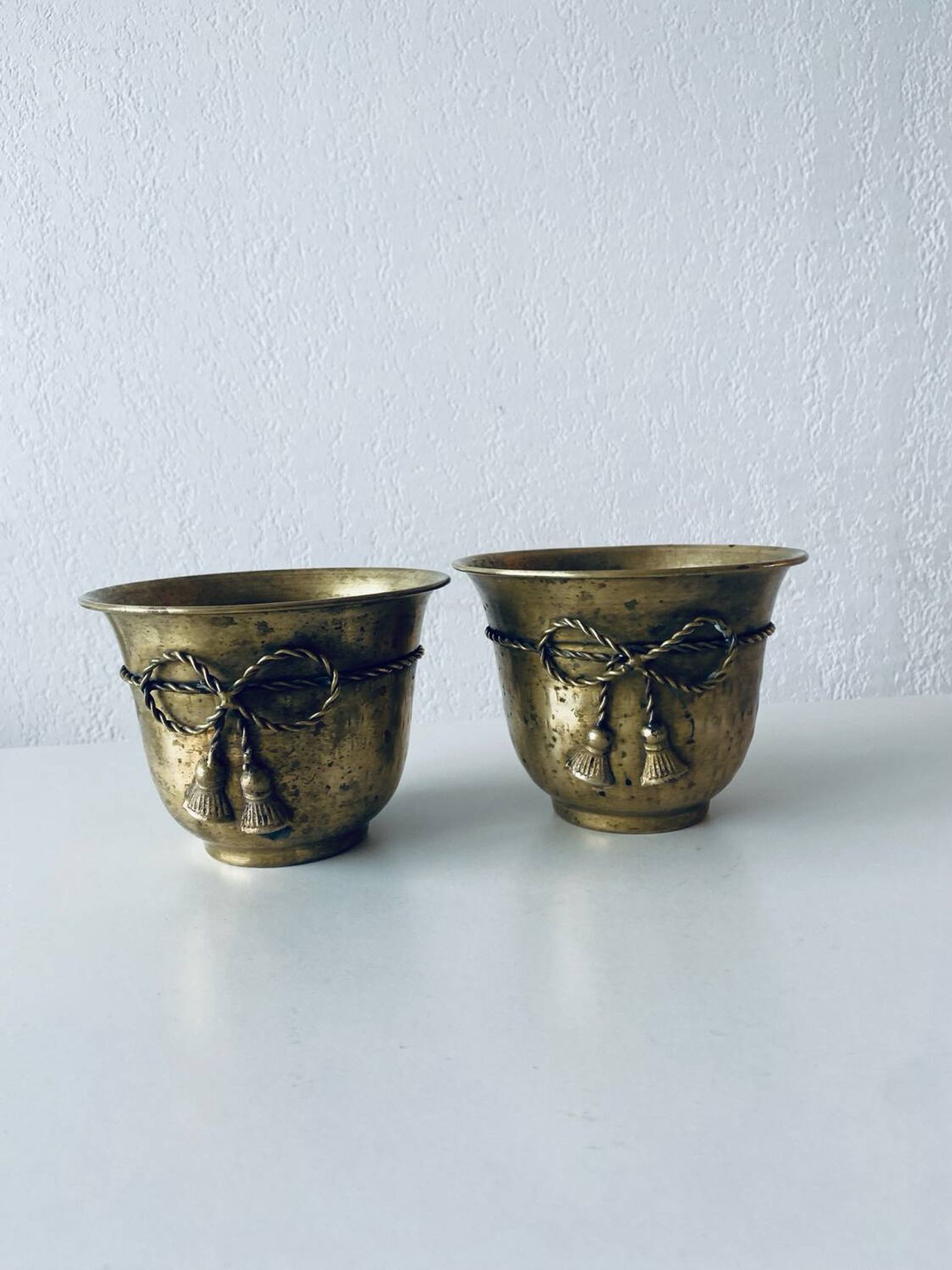 Pair of brass cord pot covers