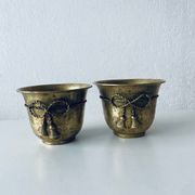 Pair of brass cord pot covers