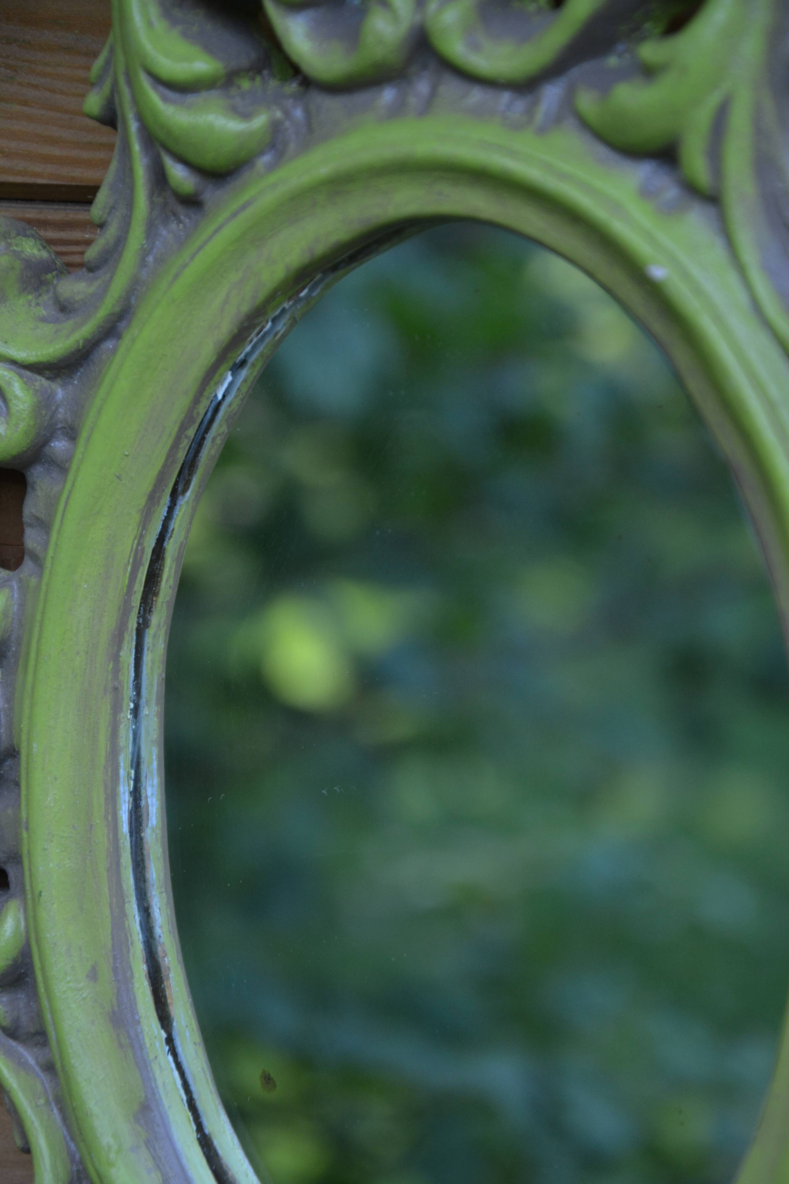 Small green wooden mirror