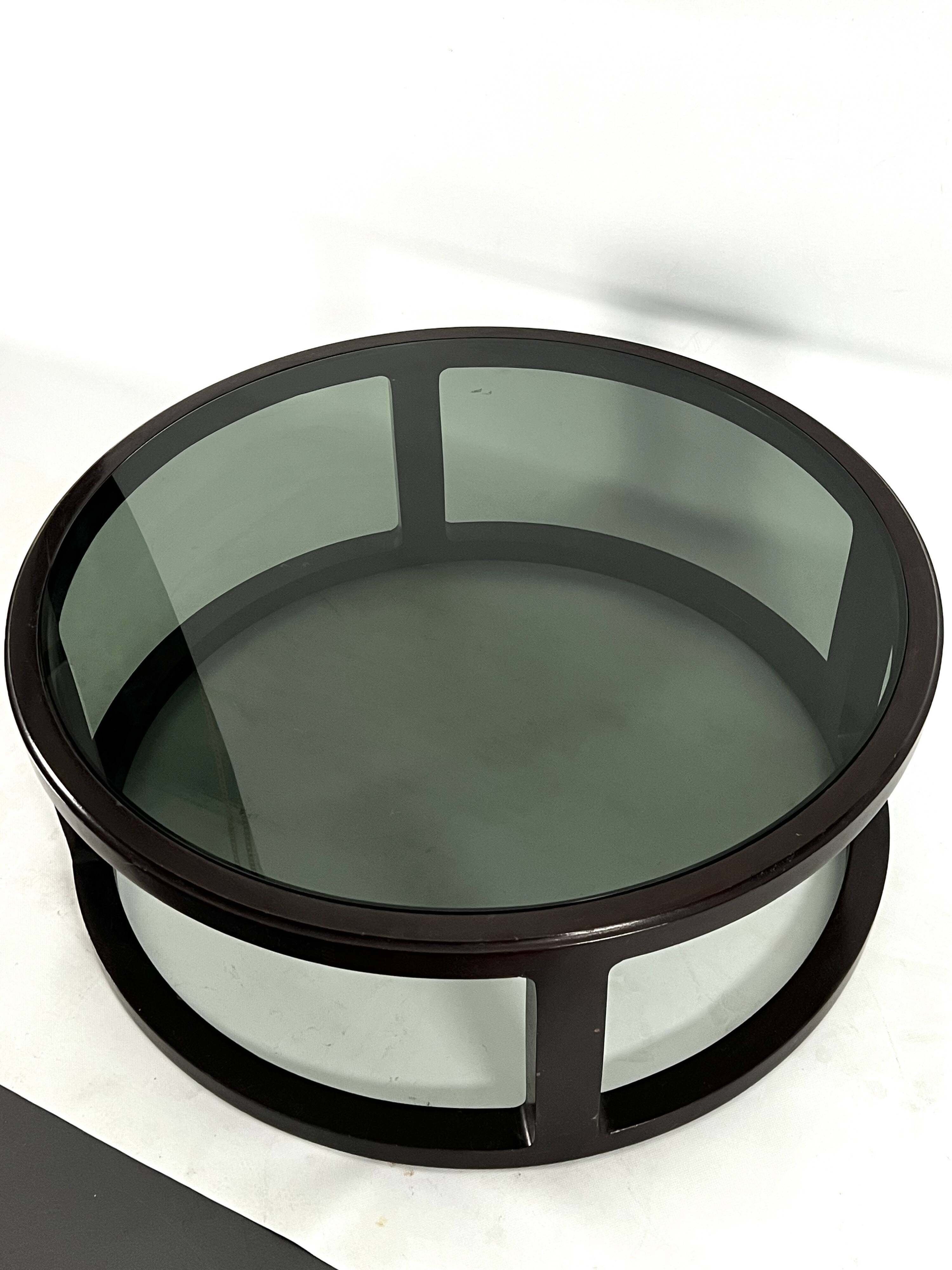 Italian Vintage Large Round coffee table in wood and fume glass. 1970s