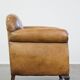 Fauteuil ancien en cuir de mouton