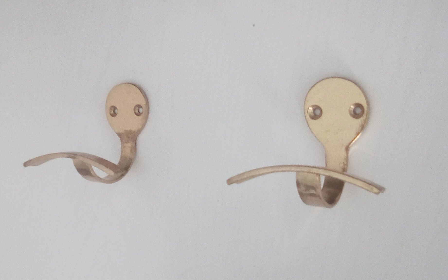 Pair of coat racks in gilded steel 70s/80s