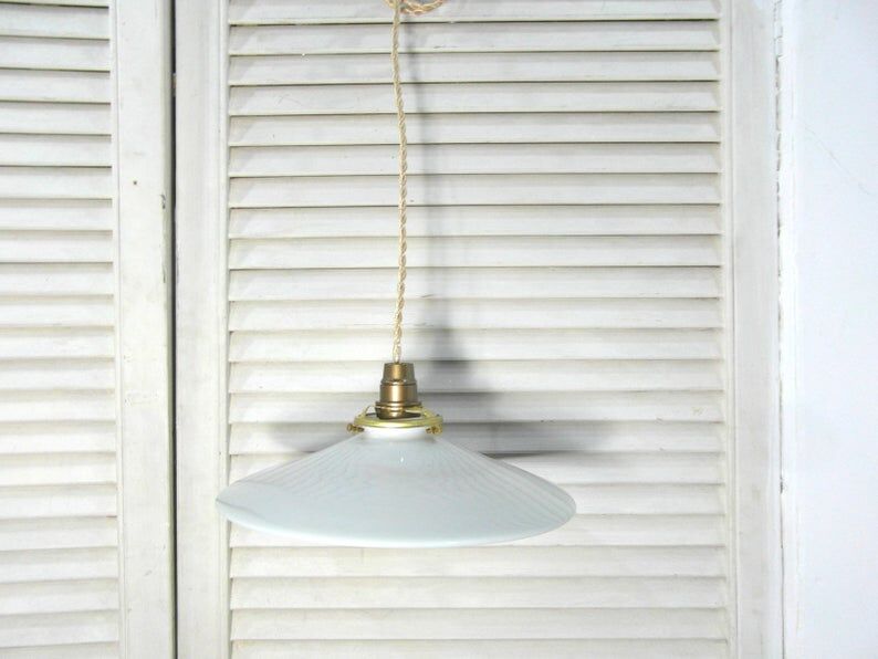 Hanging in opaque white glass.