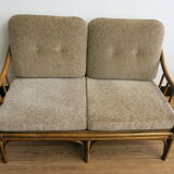 Two-seater rattan sofa with natural tones