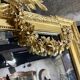 Monumental mirror Napoleon III in gilded wood with the profile of Apollo