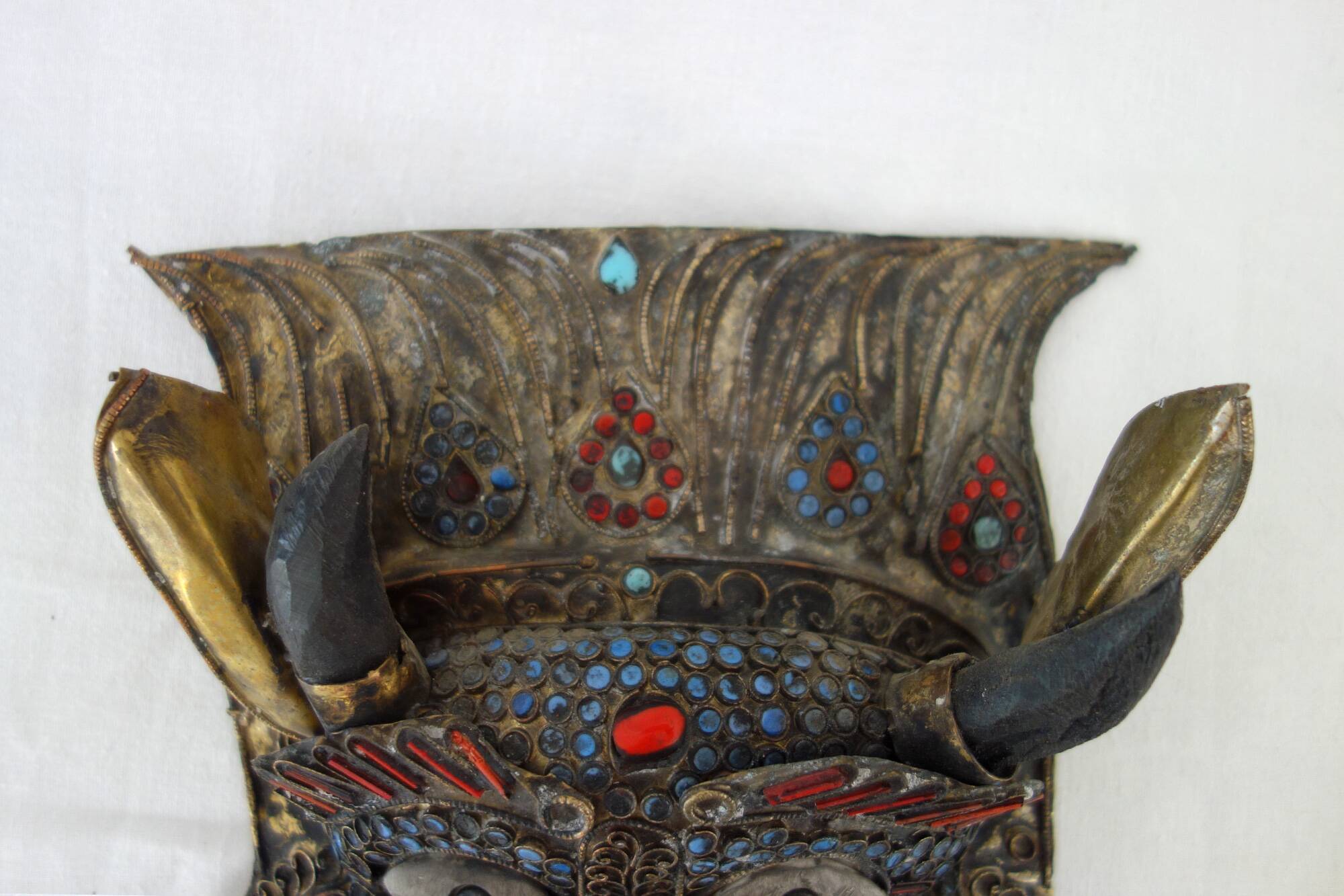 Vintage ritual mask in repoussé brass from Nepal/Tibet.