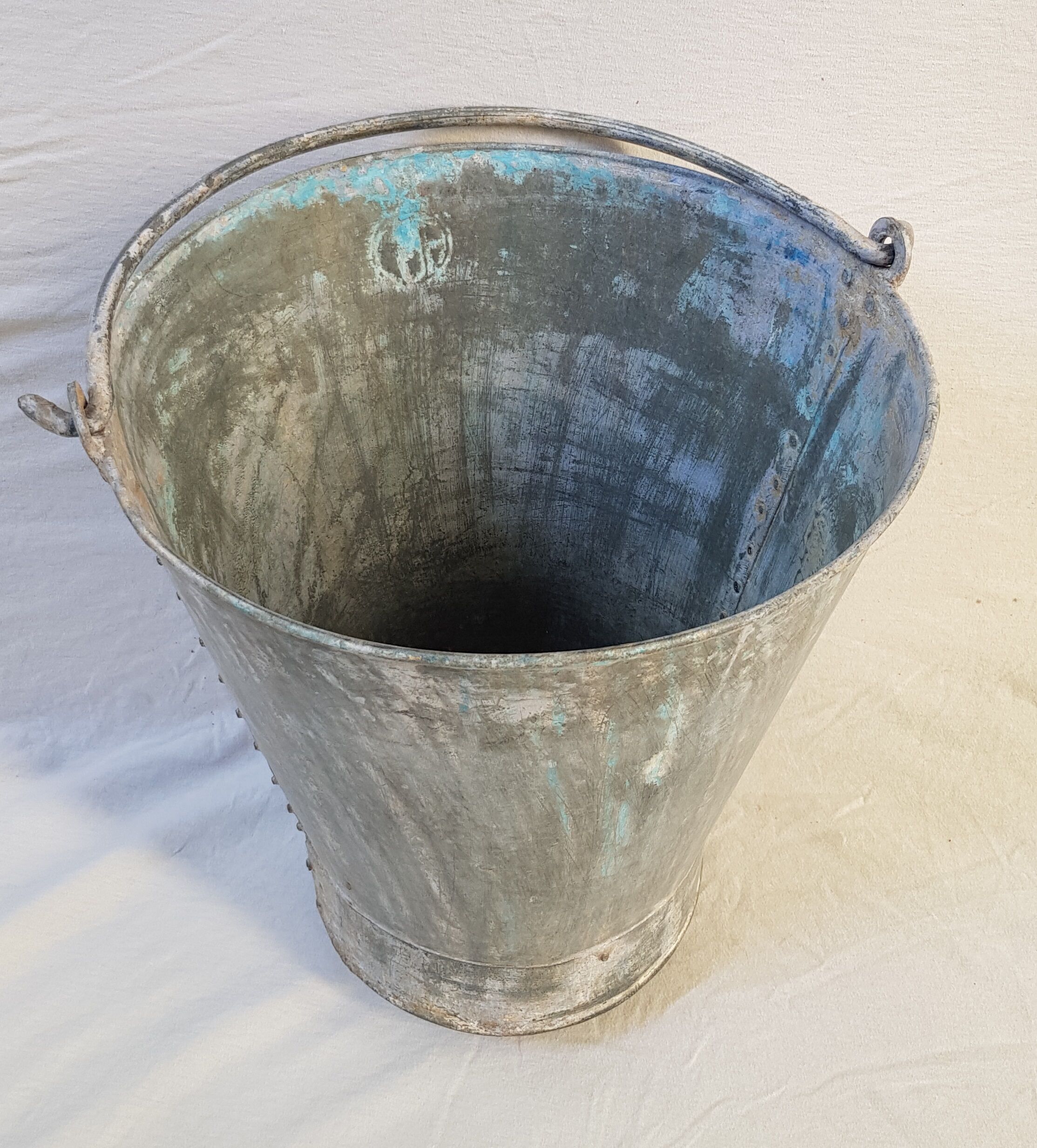 Old bucket with thick zinc handle
