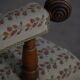Modern Danish armchair in turned wood with floral fabric, early 20th century.