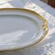 Large oval dish with gold trim in Limoges porcelain by Peconnet.
