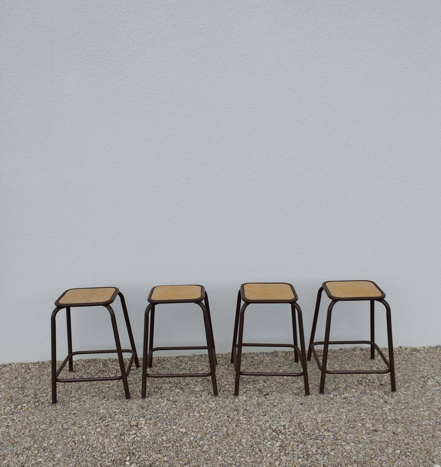 4 vintage stackable workshop stools from Mullca.