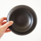 Empty round pocket in black ceramic
