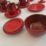 Red enamelled terracotta: cups, saucers, glasses
