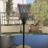 Table lamp with a crystal glass lampshade, like a vase and a golden base