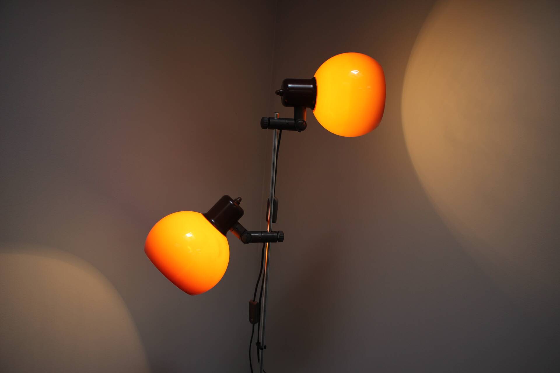 Vintage Hungarian adjustable floor lamp with two orange globe shades, circa 1970.