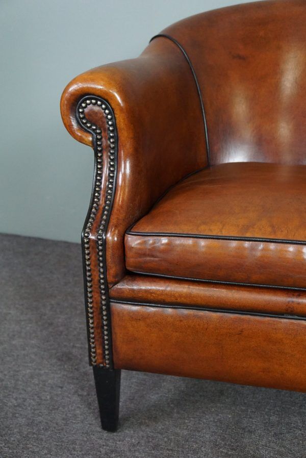 Leather club chair with black piping