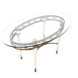 Table basse en laiton avec plateau en verre ovale dans le style de Pierluigi Colli, Italie