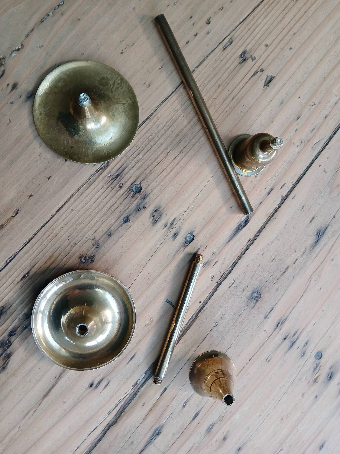 Set of two straight brass candlesticks.