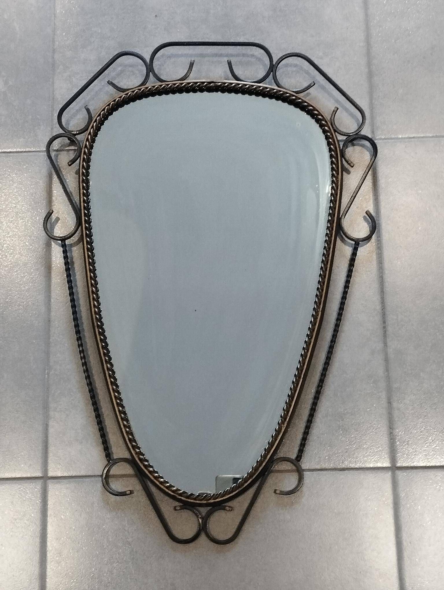 Mid-century modern iron mirror, brutalist, vintage organic, thick sixties.
