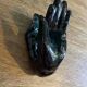 Hand-shaped coat hook