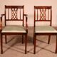 Set of 10 chairs and two mahogany armchairs in Hepplewhite style.