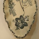 Old earthenware dish on foot
