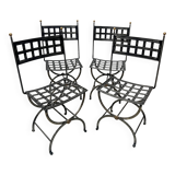Set of four wrought iron chairs, with a reclining X-shaped base, seat and backrest.