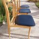 5 Scandinavian style chairs, wood and black faux leather.