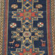 Handwoven blue ground persian rug with bird-like figures