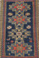 Handwoven blue ground persian rug with bird-like figures