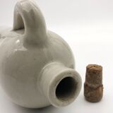 Old hot water bottle in glazed stoneware, gray color.