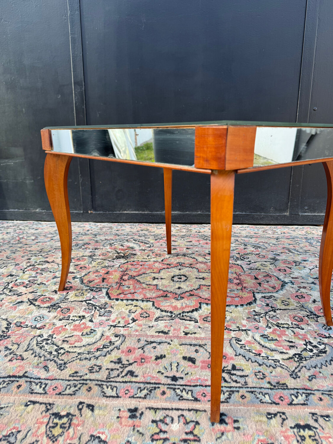 Small wooden coffee table with a mirror from the 1950s.