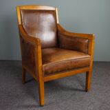 Armchair in sheepskin with beautiful light wood