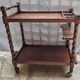 Dessert, table with wheels, side table in solid wood stained brown color France 1960