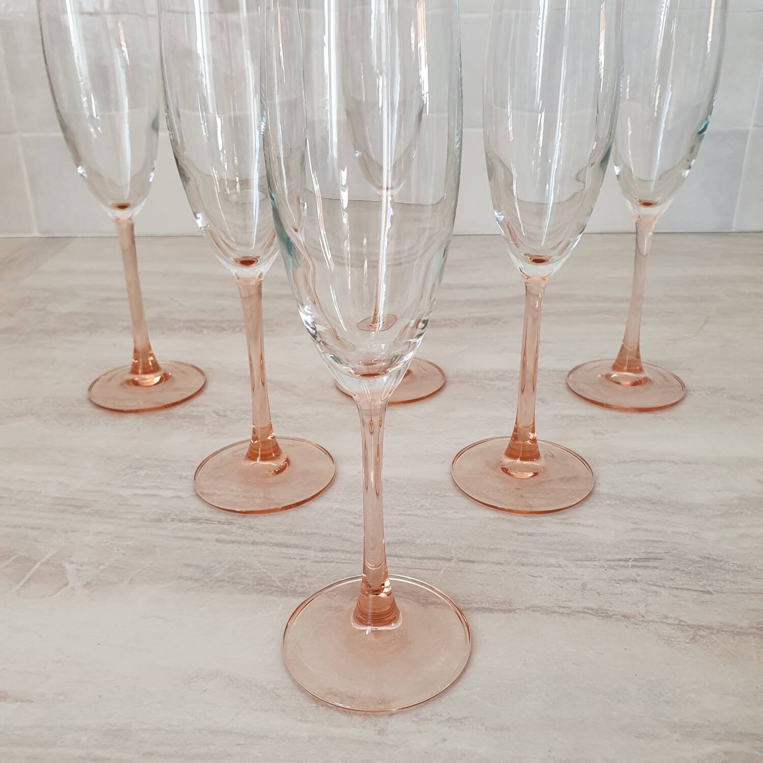 6 champagne flutes with pink stems