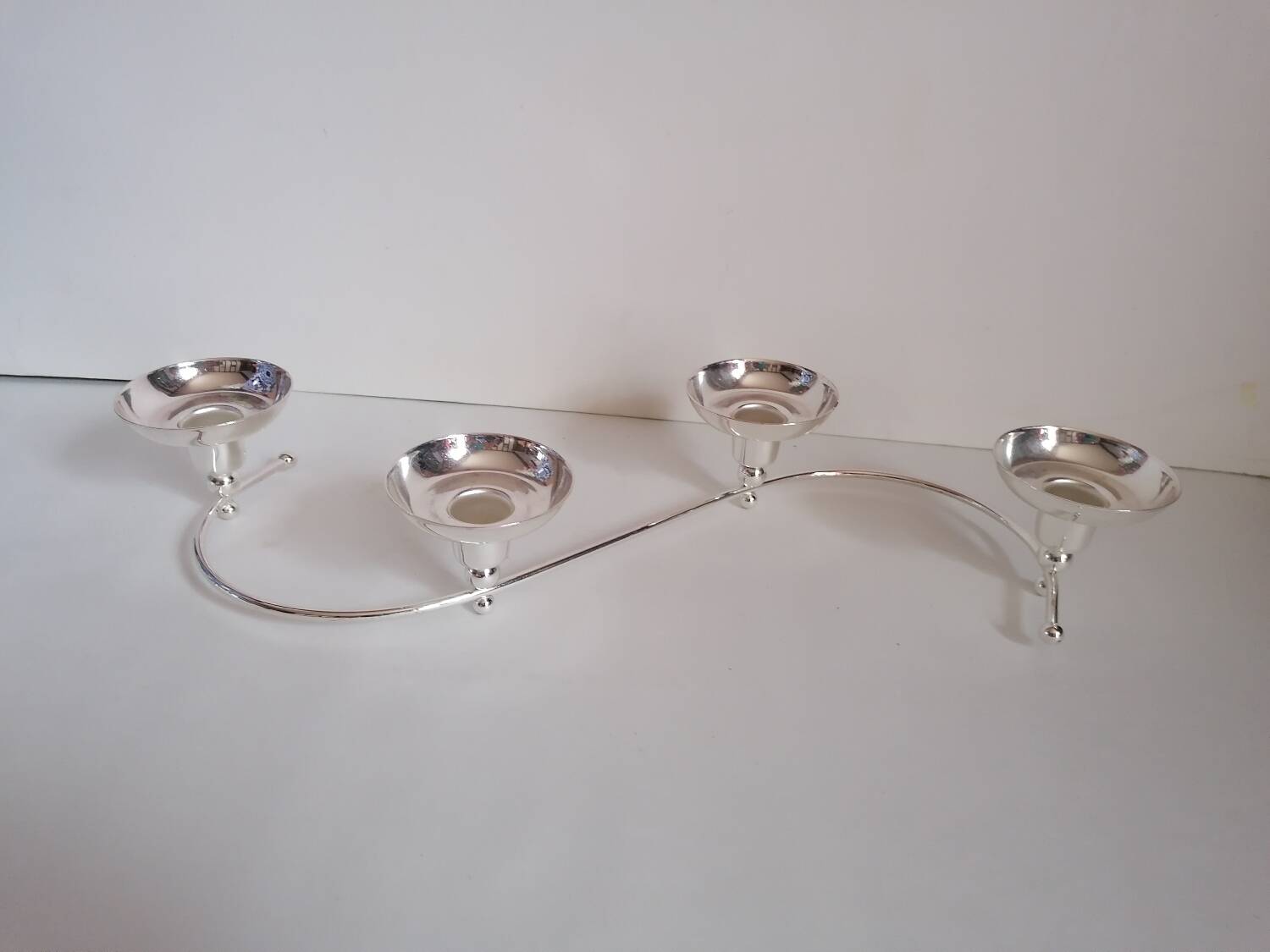 4-light silver metal candle holder