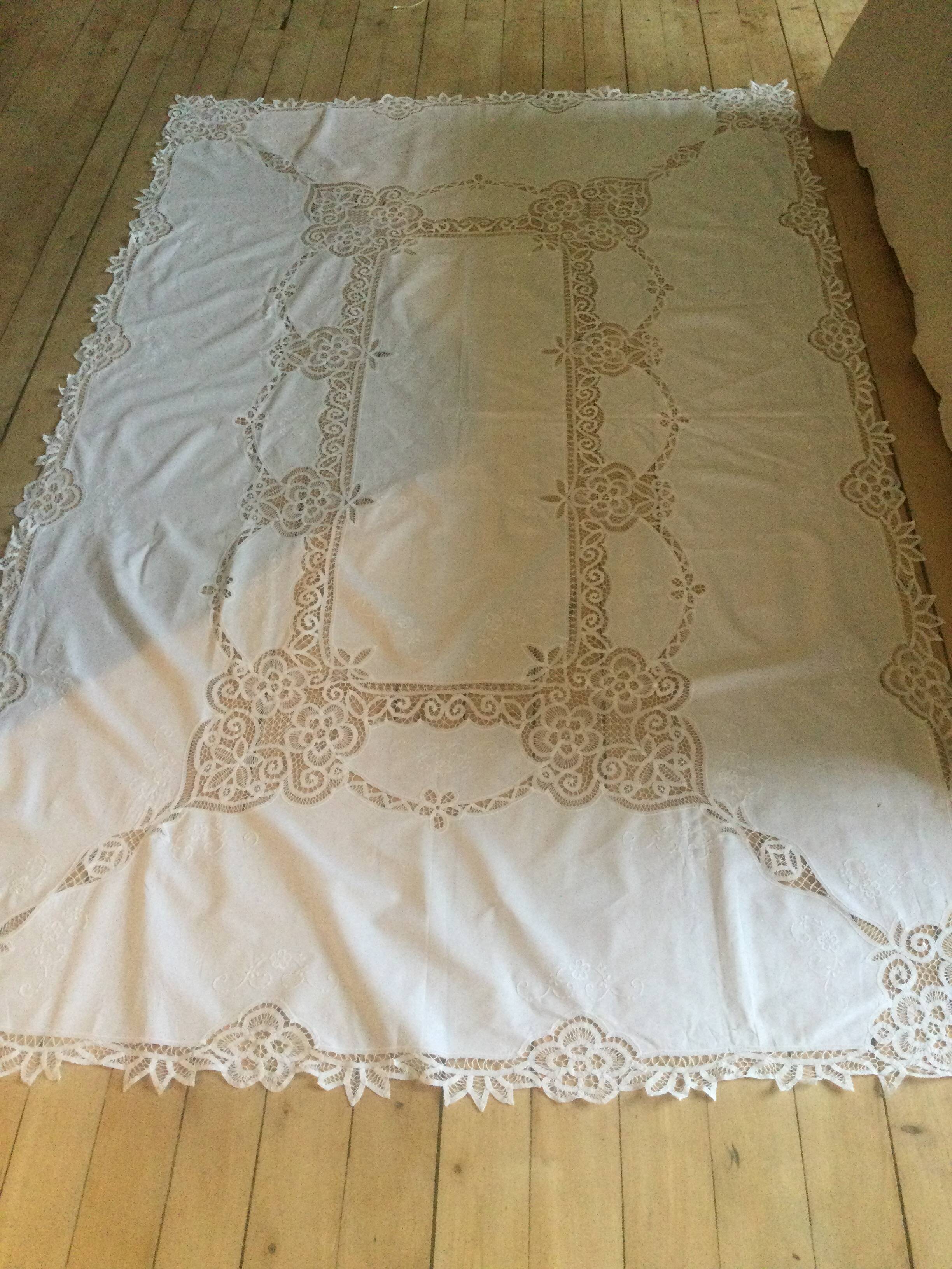 Embroidered white tablecloth and lace