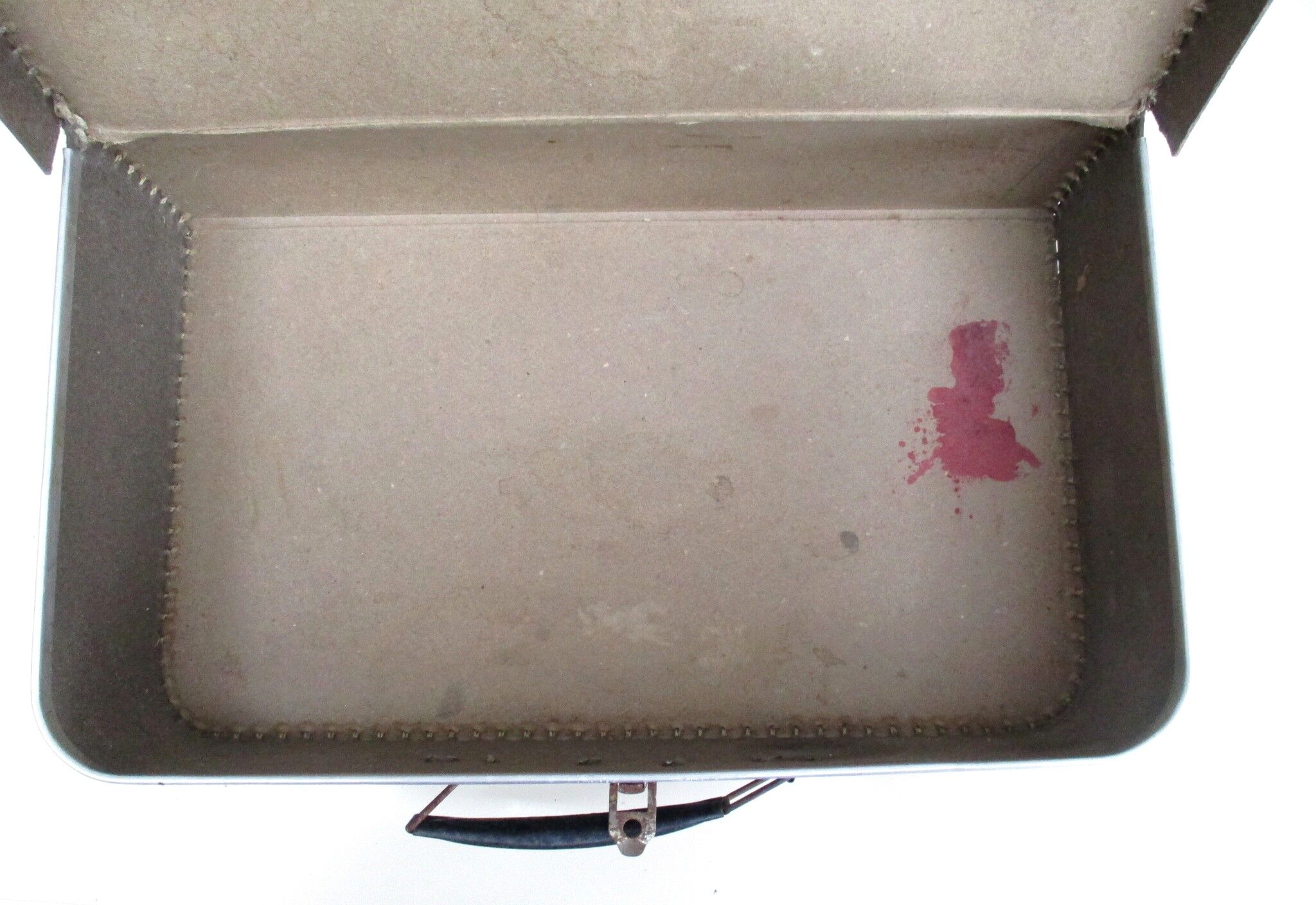 Small suitcase in old navy blue cardboard