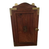 Key box in wood and brass and central motif representing a sailor's anchor