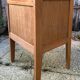 Wooden bedside table, warm tones, vintage, 1950s.