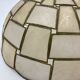 Suspension in geometric mother-of-pearl