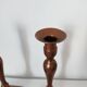 Set of a pair of candle holders and a hand candle holder